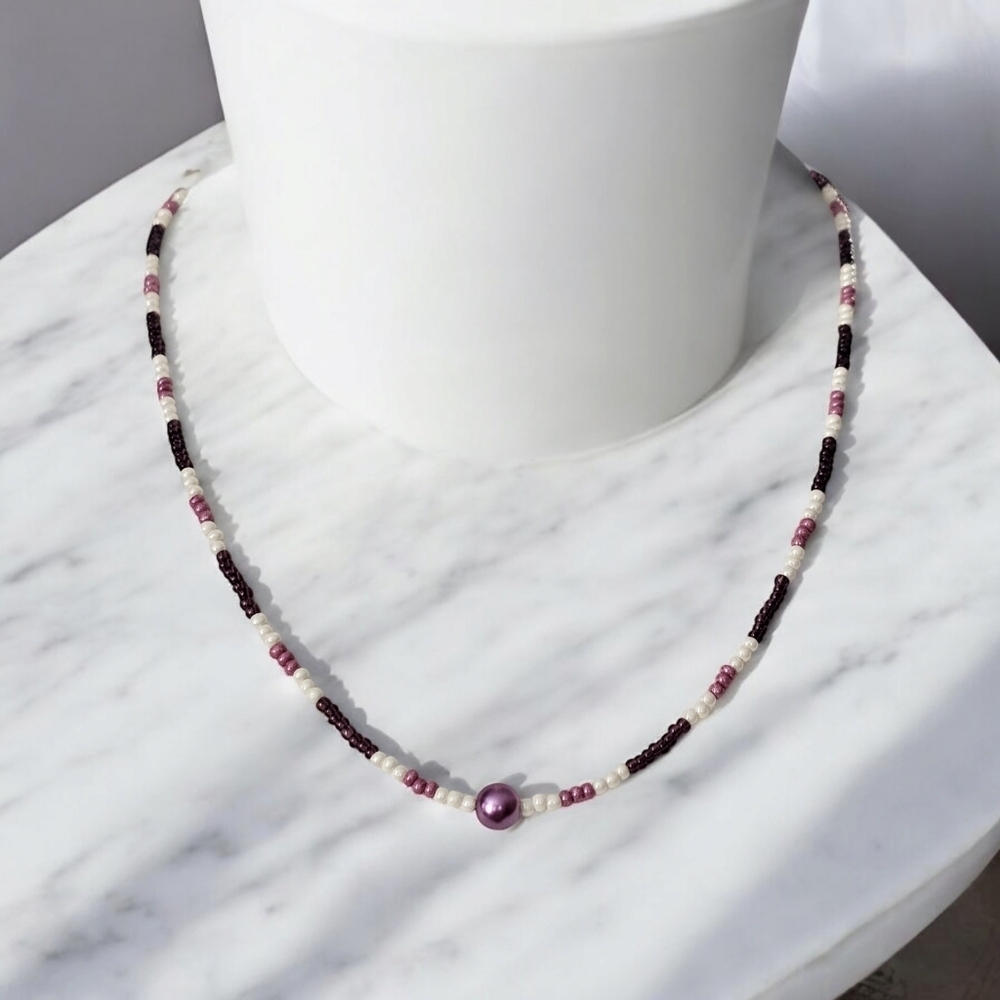 Think purple! Handmade seed bead necklace.